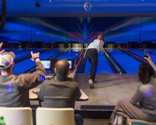 People bowling at bowlarama during cosmic bowling night.